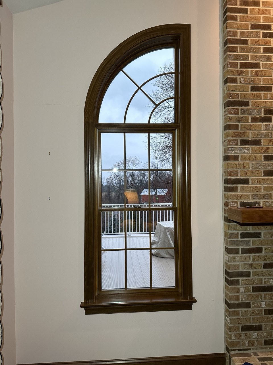 Arched window with wood frame